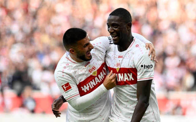 Stuttgart's Guinean forward #09 Serhou Guirassy (R) celebrates with Stuttgart's German forward #26 Deniz Undav after he scored the 3-1 goal during the German first division Bundesliga football match between VfB Stuttgart and VfL Wolfsburg in Stuttgart, southern Germany on October 7, 2023. (Photo by THOMAS KIENZLE / AFP) / DFL REGULATIONS PROHIBIT ANY USE OF PHOTOGRAPHS AS IMAGE SEQUENCES AND/OR QUASI-VIDEO