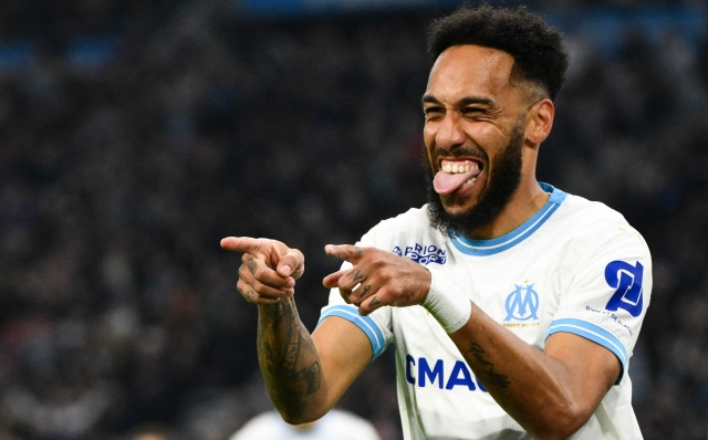 TOPSHOT - Marseille's French forward #10 Pierre-Emerick Aubameyang celebrates scoring his team's first goal during the French L1 football match between Olympique Marseille (OM) and FC Nantes at Stade Velodrome in Marseille, southern France on March 10, 2024. (Photo by CHRISTOPHE SIMON / AFP)