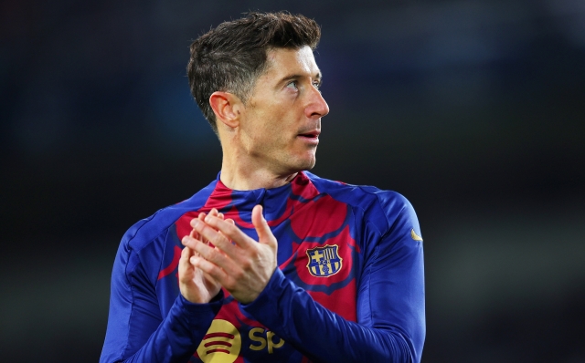 BARCELONA, SPAIN - MARCH 12: Robert Lewandowski of FC Barcelona applauds the fans during the warm up prior to the UEFA Champions League 2023/24 round of 16 second leg match between FC Barcelona and SSC Napoli at Estadi Olimpic Lluis Companys on March 12, 2024 in Barcelona, Spain. (Photo by Eric Alonso/Getty Images)