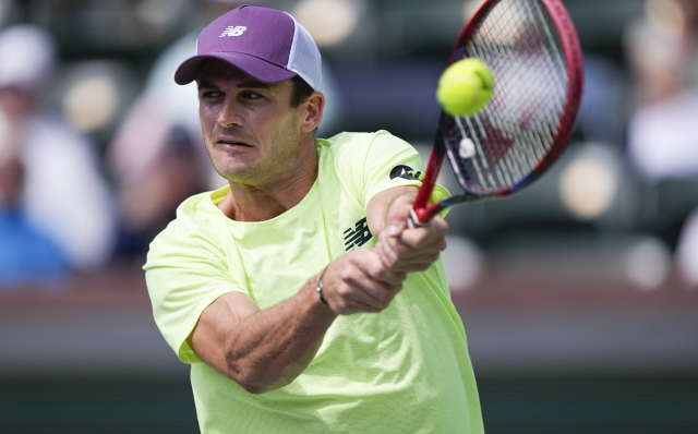 Tommy Paul, of the United States, returns to Casper Ruud, of Norway, during a quarterfinal match at the BNP Paribas Open tennis tournament, Thursday, March 14, 2024, in Indian Wells, Calif. (AP Photo/Mark J. Terrill)