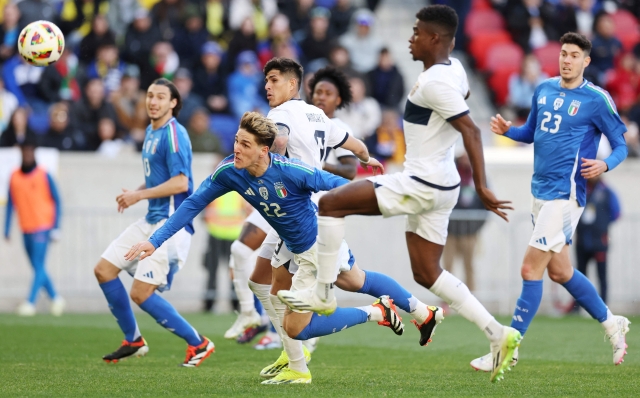 Italy's forward #22 Nicolo Zaniolo heads the ball during the international friendly football match between Italy and Ecuador at Red Bull Arena in Harrison, New Jersey, on March 24, 2024. (Photo by Charly TRIBALLEAU / AFP)