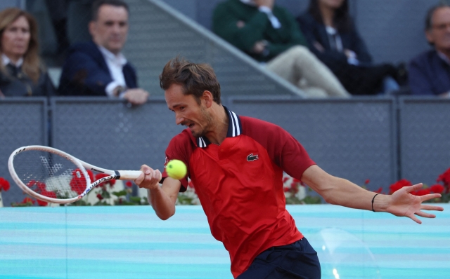 Russia's Daniil Medvedev returns the ball to Czech Republic's Jiri Lehecka during the 2024 ATP Tour Madrid Open tournament quarter-final tennis match at Caja Magica in Madrid on May 2, 2024. (Photo by PIERRE-PHILIPPE MARCOU / AFP)