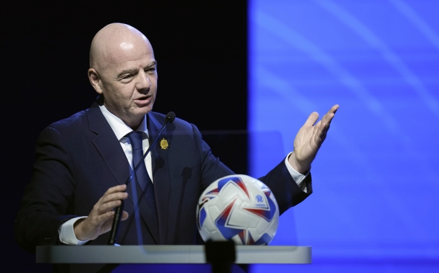 FILE - FIFA President Ganni Infantino addresses the 78th Conmebol Congress in Luque, Paraguay, Thursday, April 11, 2024. FIFA has been told to reschedule its inaugural expanded Club World Cup just over a year before the tournament is due to be hosted by America. (AP Photo/Jorge Saenz, File)