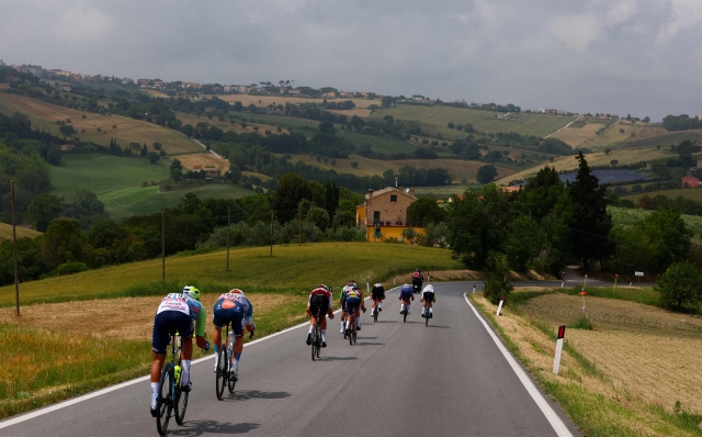 The pack rides near Civitanova Marche during the 12th stage of the 107th Giro d'Italia cycling race, 193km between Martinsicuro and Fano, on May 16, 2024. (Photo by Luca Bettini / AFP)