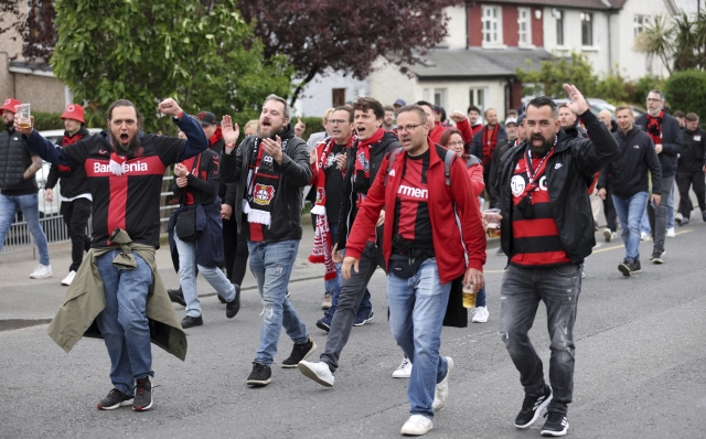 Leverkusen fans walk towards to the Aviva Stadium ahead of the Europa League final soccer match between Atalanta and Bayer Leverkusen in Dublin, Ireland, Wednesday, May 22, 2024. (AP Photo/Peter Morrison)