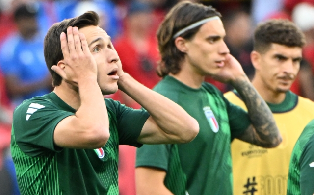 Italys forward Federico Chiesa (L) reacts during the warm up ahead of the UEFA EURO 2024 group B match between Italy and Albania at the BVB Stadion Dortmund, Germany, 15 June 2024. ANSA/DANIEL DAL ZENNAR0