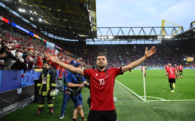 Albania's midfielder #10 Nedim Bajrami celebrates scoring his team's first goal during the UEFA Euro 2024 Group B football match between Italy and Albania at the BVB Stadion in Dortmund on June 15, 2024. (Photo by Alberto PIZZOLI / AFP)