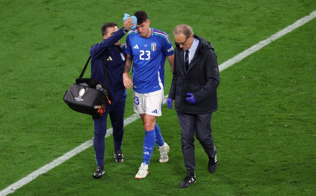 DORTMUND, GERMANY - JUNE 15: Alessandro Bastoni of Italy  leaves the field while receiving medical treatment during the UEFA EURO 2024 group stage match between Italy and Albania at Football Stadium Dortmund on June 15, 2024 in Dortmund, Germany. (Photo by Kevin C. Cox/Getty Images)