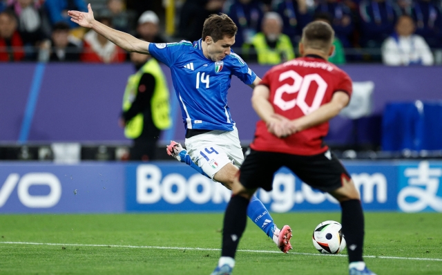 Italy's forward #14 Federico Chiesa shoots but fails to score during the UEFA Euro 2024 Group B football match between Italy and Albania at the BVB Stadion in Dortmund on June 15, 2024. (Photo by KENZO TRIBOUILLARD / AFP)