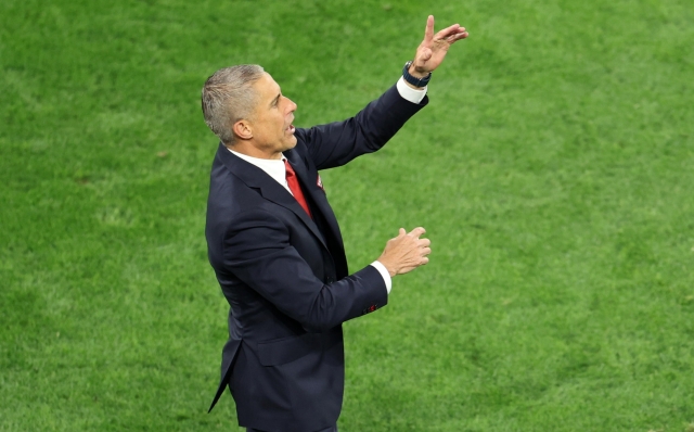 epa11413736 Head coach Sylvinho of Albania gestures during the UEFA EURO 2024 group B soccer match between Italy and Albania, in Dortmund, Germany, 15 June 2024.  EPA/GEORGI LICOVSKI