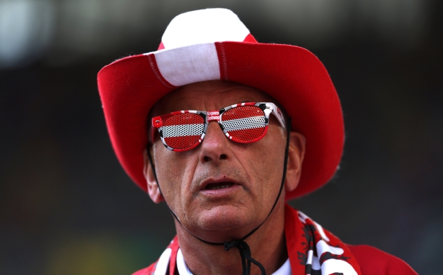 DUSSELDORF, GERMANY - JUNE 17: A fan of Austria looks on whilst wearing sunglasses in the colour of the national flag prior to the UEFA EURO 2024 group stage match between Austria and France at Düsseldorf Arena on June 17, 2024 in Dusseldorf, Germany. (Photo by Kevin C. Cox/Getty Images)