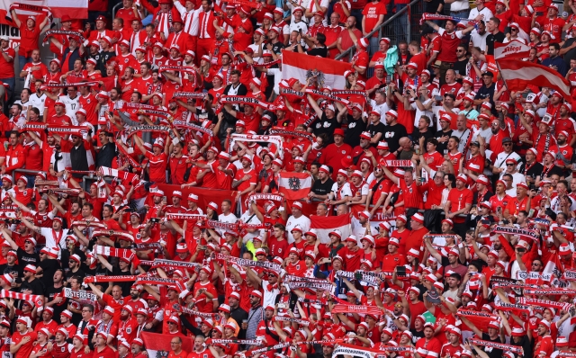 DUSSELDORF, GERMANY - JUNE 17: A general view of fans of Austria as they sing their national anthem prior to the UEFA EURO 2024 group stage match between Austria and France at Düsseldorf Arena on June 17, 2024 in Dusseldorf, Germany. (Photo by Lars Baron/Getty Images)