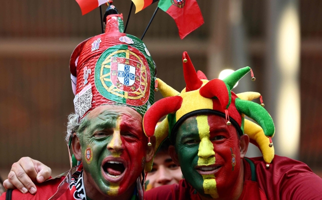 Portugal's fans pose prior the UEFA Euro 2024 Group F football match between Portugal and the Czech Republic at the Leipzig Stadium in Leipzig on June 18, 2024. (Photo by Christophe SIMON / AFP)
