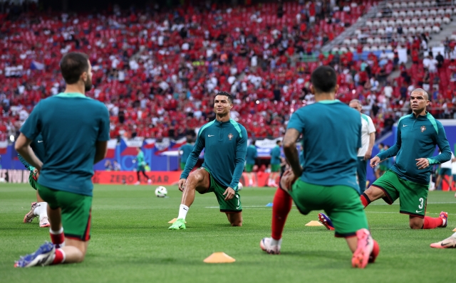 LEIPZIG, GERMANY - JUNE 18: Cristiano Ronaldo of Portugal looks on as he warms up with teammates prior to the UEFA EURO 2024 group stage match between Portugal and Czechia at Football Stadium Leipzig on June 18, 2024 in Leipzig, Germany. (Photo by Alex Livesey/Getty Images)