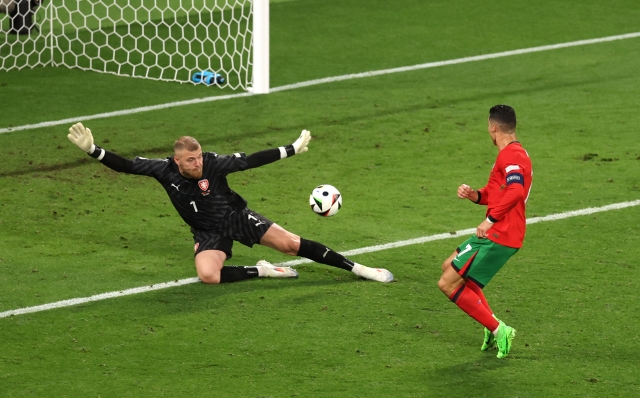 LEIPZIG, GERMANY - JUNE 18: Jindrich Stanek of Czechia saves a shot from Cristiano Ronaldo of Portugal during the UEFA EURO 2024 group stage match between Portugal and Czechia at Football Stadium Leipzig on June 18, 2024 in Leipzig, Germany. (Photo by Julian Finney/Getty Images)