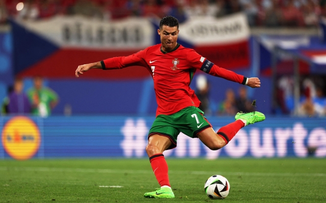 Portugal's forward #07 Cristiano Ronaldo crosses the ball during the UEFA Euro 2024 Group F football match between Portugal and the Czech Republic at the Leipzig Stadium in Leipzig on June 18, 2024. (Photo by Adrian DENNIS / AFP)