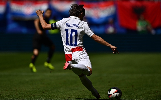 Croatia's midfielder #10 Luka Modric shoots the ball during the UEFA Euro 2024 Group B football match between Croatia and Albania at the Volksparkstadion in Hamburg on June 19, 2024. (Photo by GABRIEL BOUYS / AFP)