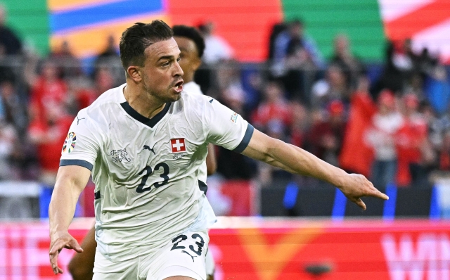 Switzerland's midfielder #23 Xherdan Shaqiri celebrates scoring his team's first goal during the UEFA Euro 2024 Group A football match between Scotland and Switzerland at the Cologne Stadium in Cologne on June 19, 2024. (Photo by JAVIER SORIANO / AFP)