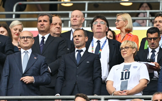 UEFA President Aleksander Ceferin (C) and Slovenian President Natasa Pirc Musar (R) attend the UEFA Euro 2024 Group C football match between Slovenia and Serbia at the Munich Football Arena in Munich on June 20, 2024. (Photo by Miguel MEDINA / AFP)
