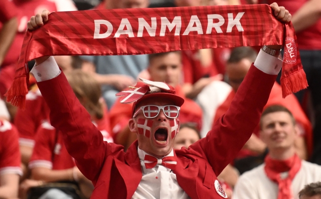 A Denmark fan displays his scarf prior to the UEFA Euro 2024 Group C football match between Denmark and England at the Frankfurt Arena in Frankfurt am Main on June 20, 2024. (Photo by Angelos TZORTZINIS / AFP)
