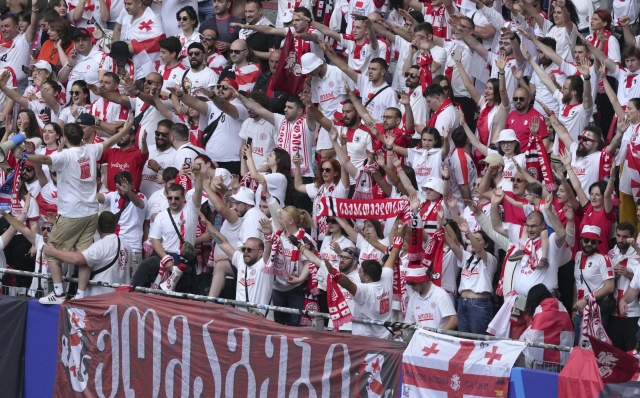 Georgia fans cheer ahead a Group F match between Georgia and the Czech Republic at the Euro 2024 soccer tournament in Hamburg, Germany, Saturday, June 22, 2024. (AP Photo/Sunday Alamba)