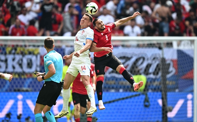 Czech Republic's midfielder #14 Lukas Provod (L) and Georgia's midfielder #06 Giorgi Kochorashvili (R) fight for the ball during the UEFA Euro 2024 Group F football match between Georgia and the Czech Republic at the Volksparkstadion in Hamburg on June 22, 2024. (Photo by GABRIEL BOUYS / AFP)