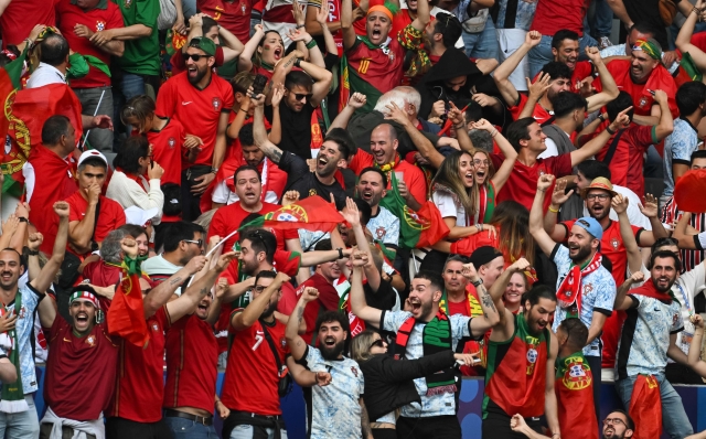 Portugal's supporters celebrates scoring their team's second goal during the UEFA Euro 2024 Group F football match between Turkey and Portugal at the BVB Stadion in Dortmund on June 22, 2024. (Photo by Miguel MEDINA / AFP)