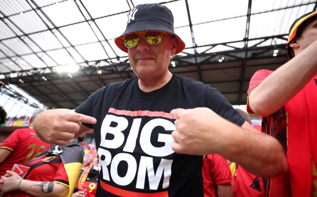 COLOGNE, GERMANY - JUNE 22: A fan of Belgium poses for a photo whilst wearing a t-shirt with reads 'BIG ROM' prior to the UEFA EURO 2024 group stage match between Belgium and Romania at Cologne Stadium on June 22, 2024 in Cologne, Germany. (Photo by Alex Grimm/Getty Images)