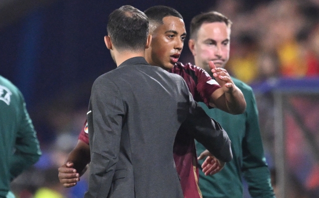Belgium's head coach Domenico Tedesco greets Belgium's midfielder #08 Youri Tielemans as he comes off during the UEFA Euro 2024 Group E football match between Belgium and Romania at the Cologne Stadium in Cologne on June 22, 2024. (Photo by Kirill KUDRYAVTSEV / AFP)