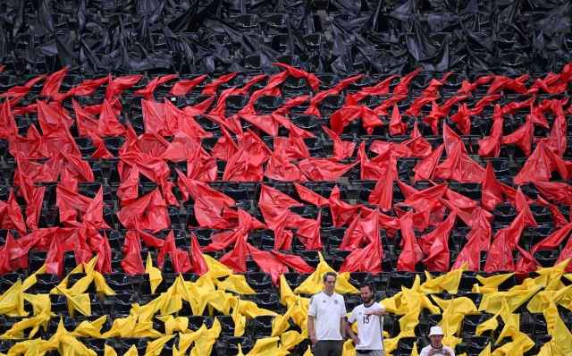 Supporters of Germany are pictured on a tribune decorated as German flag prior to the UEFA Euro 2024 Group A football match between Switzerland and Germany at the Frankfurt Arena in Frankfurt am Main on June 23, 2024. (Photo by Kirill KUDRYAVTSEV / AFP)