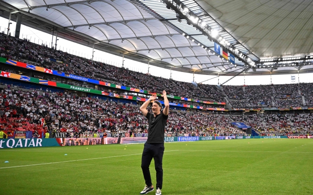 Switzerland's head coach Murat Yakin waves to fans prior to the UEFA Euro 2024 Group A football match between Switzerland and Germany at the Frankfurt Arena in Frankfurt am Main on June 23, 2024. (Photo by Kirill KUDRYAVTSEV / AFP)