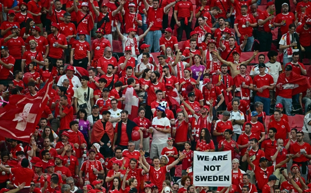 Switzerland fans cheer prior to the UEFA Euro 2024 Group A football match between Switzerland and Germany at the Frankfurt Arena in Frankfurt am Main on June 23, 2024. (Photo by Tobias SCHWARZ / AFP)