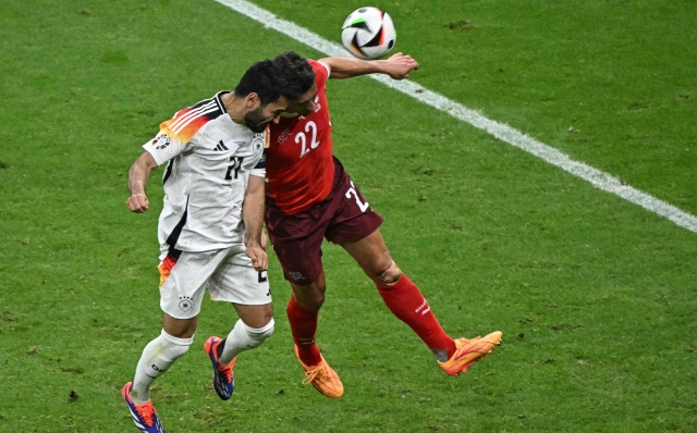 Germany's midfielder #21 Ilkay Gundogan and Switzerland's defender #22 Fabian Schaer vie for the ball during the UEFA Euro 2024 Group A football match between Switzerland and Germany at the Frankfurt Arena in Frankfurt am Main on June 23, 2024. (Photo by JAVIER SORIANO / AFP)