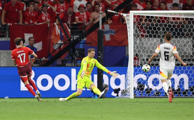 FRANKFURT AM MAIN, GERMANY - JUNE 23: Ruben Vargas of Switzerland scores a goal as Manuel Neuer of Germany fails to make a save, which is later disallowed after an offside decision following a VAR Review, during the UEFA EURO 2024 group stage match between Switzerland and Germany at Frankfurt Arena on June 23, 2024 in Frankfurt am Main, Germany. (Photo by Alexander Hassenstein/Getty Images)