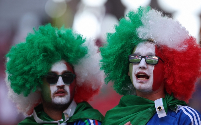Italy fans wearing wigs and face paint in the national colours await kickoff in the UEFA Euro 2024 Group B football match between the Croatia and Italy at the Leipzig Stadium in Leipzig on June 24, 2024. (Photo by Ronny HARTMANN / AFP)