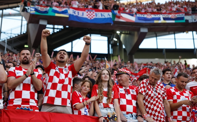 Croatia's supporters cheer during the UEFA Euro 2024 Group B football match between Croatia and Italy at the Leipzig Stadium in Leipzig on June 24, 2024. (Photo by Odd ANDERSEN / AFP)
