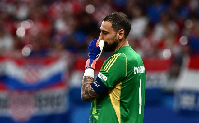 Italy's goalkeeper #01 Gianluigi Donnarumma reacts during the UEFA Euro 2024 Group B football match between Croatia and Italy at the Leipzig Stadium in Leipzig on June 24, 2024. (Photo by GABRIEL BOUYS / AFP)