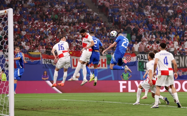 LEIPZIG, GERMANY - JUNE 24: Alessandro Bastoni of Italy wins a header during the UEFA EURO 2024 group stage match between Croatia and Italy at Football Stadium Leipzig on June 24, 2024 in Leipzig, Germany. (Photo by Julian Finney/Getty Images)