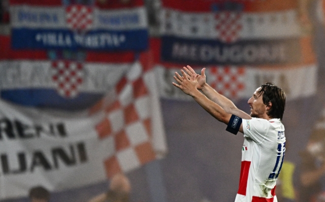 TOPSHOT - Croatia's midfielder #10 Luka Modric celebrates scoring his team's first goal during the UEFA Euro 2024 Group B football match between the Croatia and Italy at the Leipzig Stadium in Leipzig on June 24, 2024. (Photo by GABRIEL BOUYS / AFP)