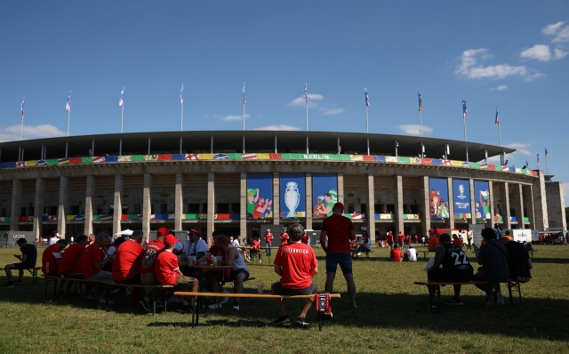 BERLIN, GERMANY - JUNE 25: Austria fans look on outside the stadium prior to the UEFA EURO 2024 group stage match between Netherlands and Austria at Olympiastadion on June 25, 2024 in Berlin, Germany. (Photo by Julian Finney/Getty Images)