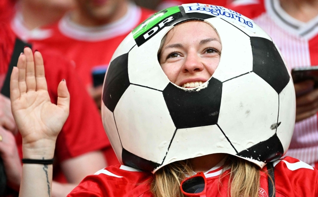 A Denmark supporter cheers prior to the  UEFA Euro 2024 Group C football match between Denmark and Serbia at the Munich Football Arena in Munich on June 25, 2024. (Photo by MIGUEL MEDINA / AFP)