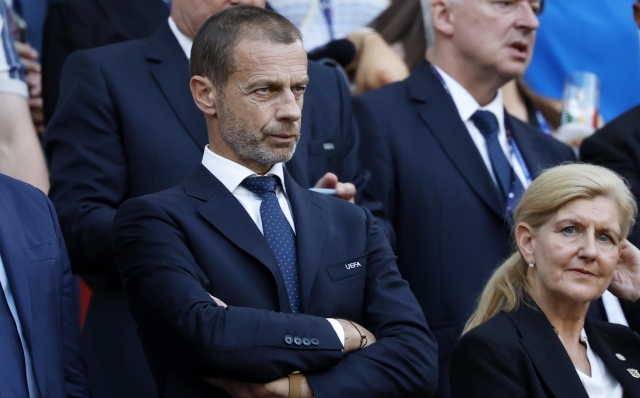 epa11437546 UEFA President Aleksander Ceferin watches the UEFA EURO 2024 group C soccer match between England and Slovenia, in Cologne, Germany, 25 June 2024.  EPA/YOAN VALAT