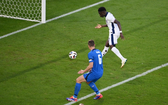 COLOGNE, GERMANY - JUNE 25: Bukayo Saka of England scores a goal which is later disallowed following an offside decision during the UEFA EURO 2024 group stage match between England and Slovenia at Cologne Stadium on June 25, 2024 in Cologne, Germany. (Photo by Matthias Hangst/Getty Images)