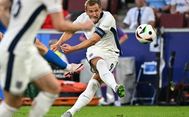 England's forward #09 Harry Kane shoots but fails to score during the UEFA Euro 2024 Group C football match between England and Slovenia at the Cologne Stadium in Cologne on June 25, 2024. (Photo by JAVIER SORIANO / AFP)