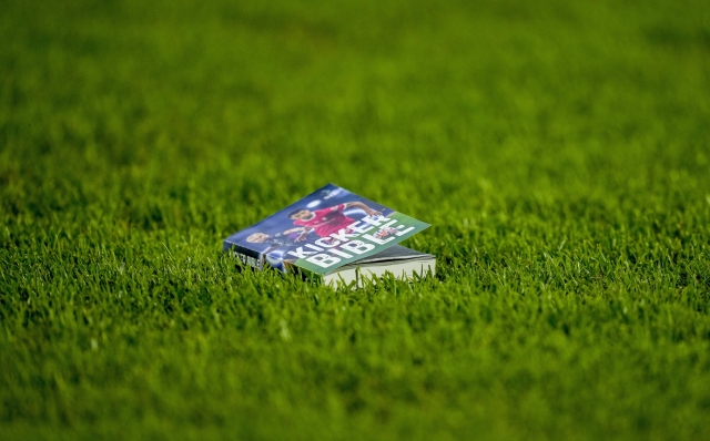 A book is thrown on the pitch by spectators during a Group C match between the England and Slovenia at the Euro 2024 soccer tournament in Cologne, Germany, Tuesday, June 25, 2024. (AP Photo/Andreea Alexandru)