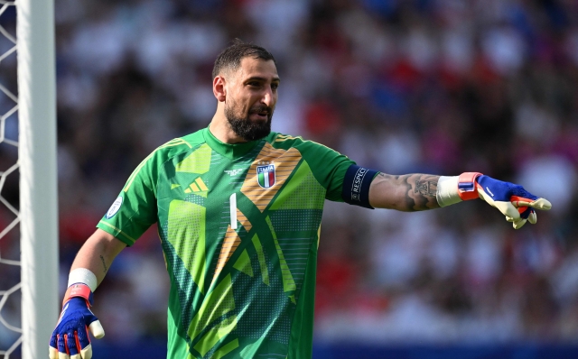 Italy's goalkeeper #01 Gianluigi Donnarumma gestures during the UEFA Euro 2024 round of 16 football match between Switzerland and Italy at the Olympiastadion Berlin in Berlin on June 29, 2024. (Photo by Kirill KUDRYAVTSEV / AFP)
