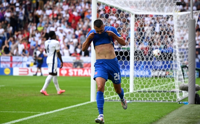 GELSENKIRCHEN, GERMANY - JUNE 30: Ivan Schranz of Slovakia celebrates scoring his team's first goal during the UEFA EURO 2024 round of 16 match between England and Slovakia at Arena AufSchalke on June 30, 2024 in Gelsenkirchen, Germany. (Photo by Clive Mason/Getty Images)