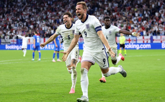 GELSENKIRCHEN, GERMANY - JUNE 30: Harry Kane of England celebrates scoring his team's second goal during the UEFA EURO 2024 round of 16 match between England and Slovakia at Arena AufSchalke on June 30, 2024 in Gelsenkirchen, Germany. (Photo by Carl Recine/Getty Images)