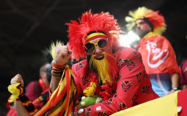 DUSSELDORF, GERMANY - JULY 01: A fan of Belgium, wearing fancy dress, poses for a photograph as he enjoys the pre match atmosphere prior to the UEFA EURO 2024 round of 16 match between France and Belgium at Düsseldorf Arena on July 01, 2024 in Dusseldorf, Germany. (Photo by Alex Livesey/Getty Images)