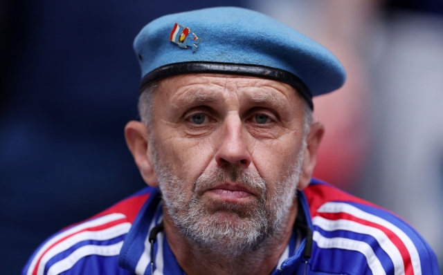 DUSSELDORF, GERMANY - JULY 01: A fan of France, wearing a Beret, looks on as he enjoys the pre match atmosphere prior to the UEFA EURO 2024 round of 16 match between France and Belgium at Düsseldorf Arena on July 01, 2024 in Dusseldorf, Germany. (Photo by Dean Mouhtaropoulos/Getty Images)